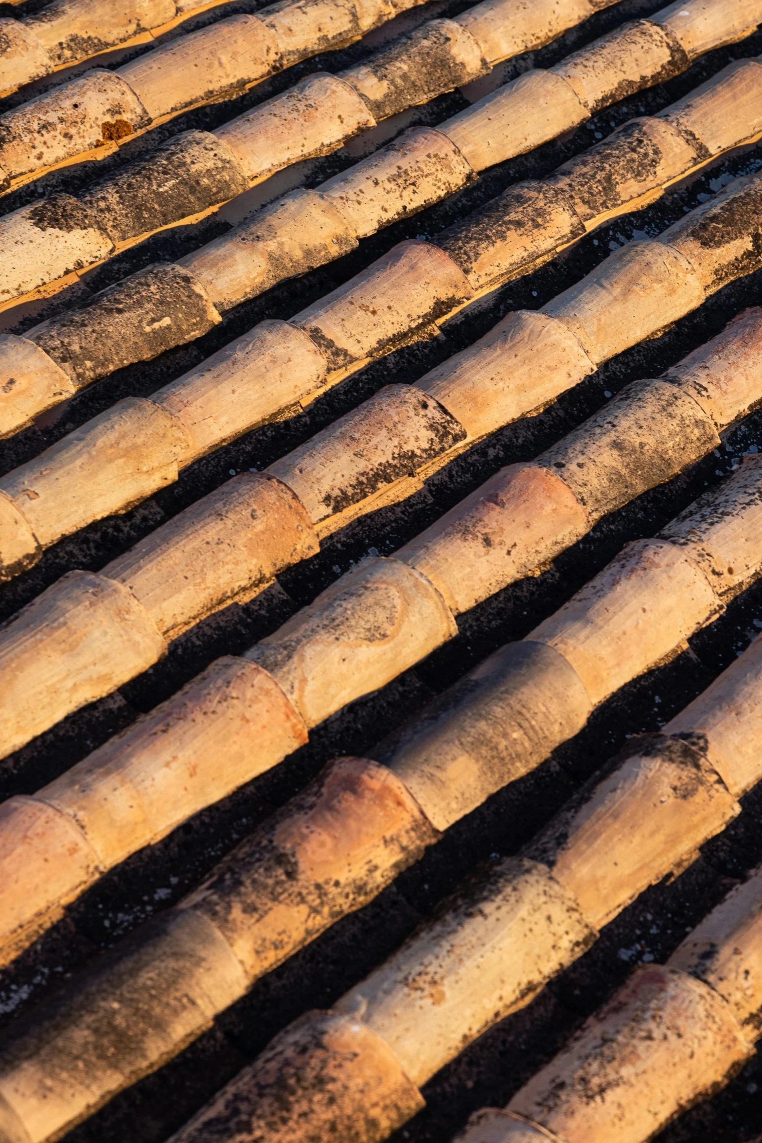 a tiled roof made of tiles sitting on top of a sidewalk