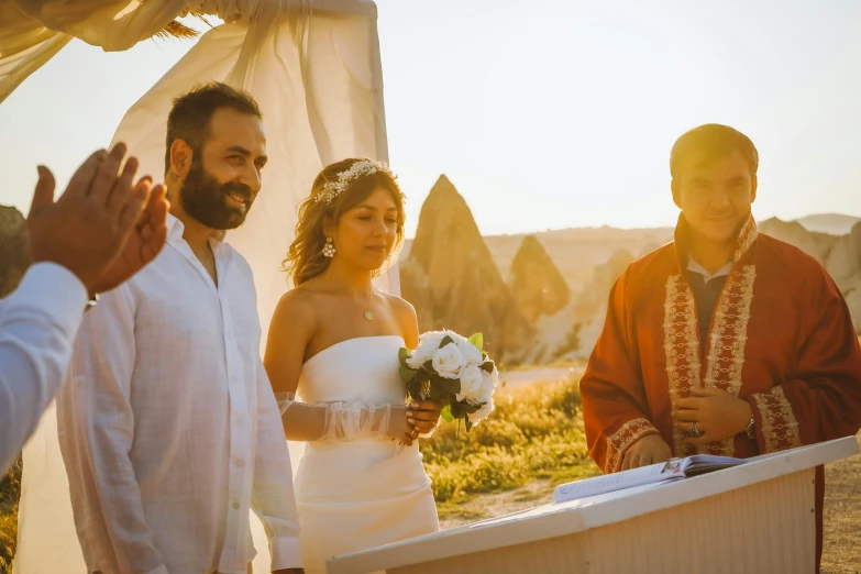 a bride is walking with her groom down the aisle