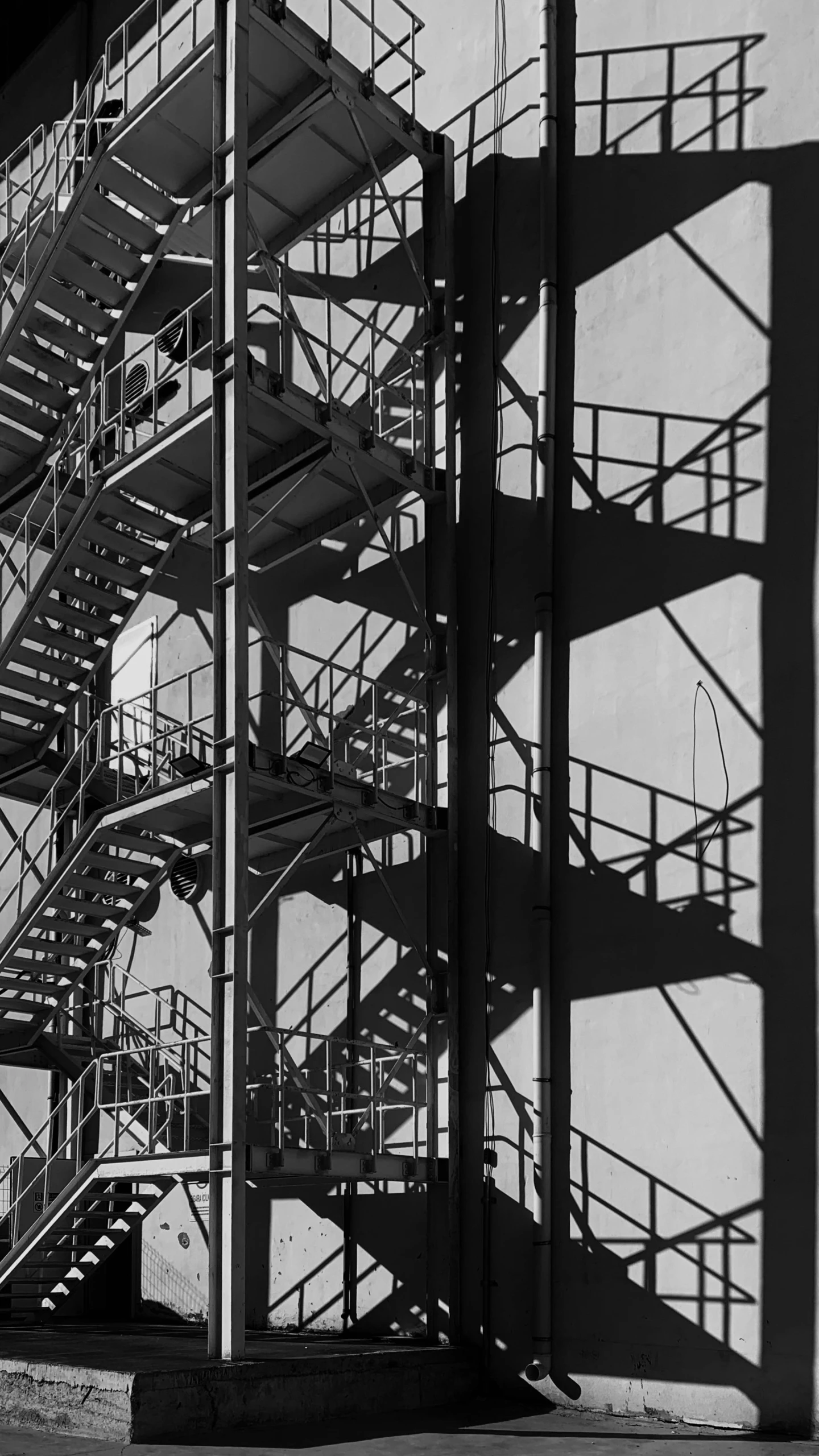 a group of metal stairs on the side of a building