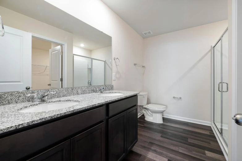 a very large and clean bathroom with an open shower