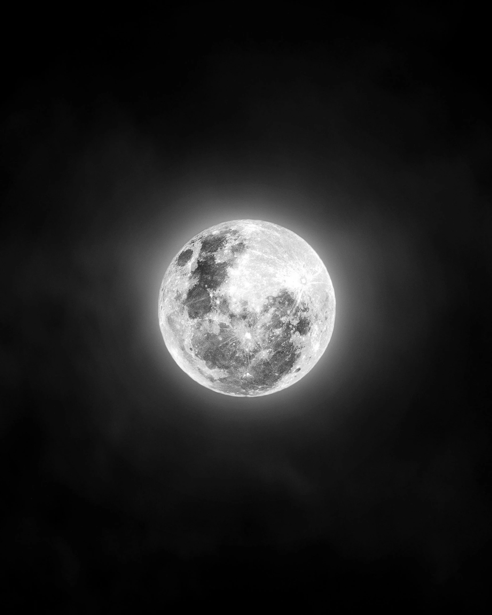 a black and white po of the full moon