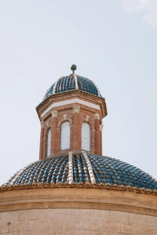 a domed, decorative building with a sky view