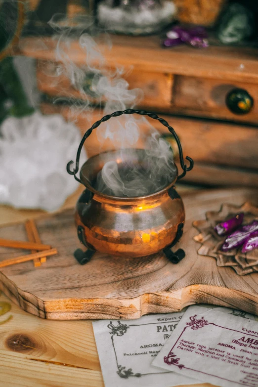 a small pot with steam coming from it