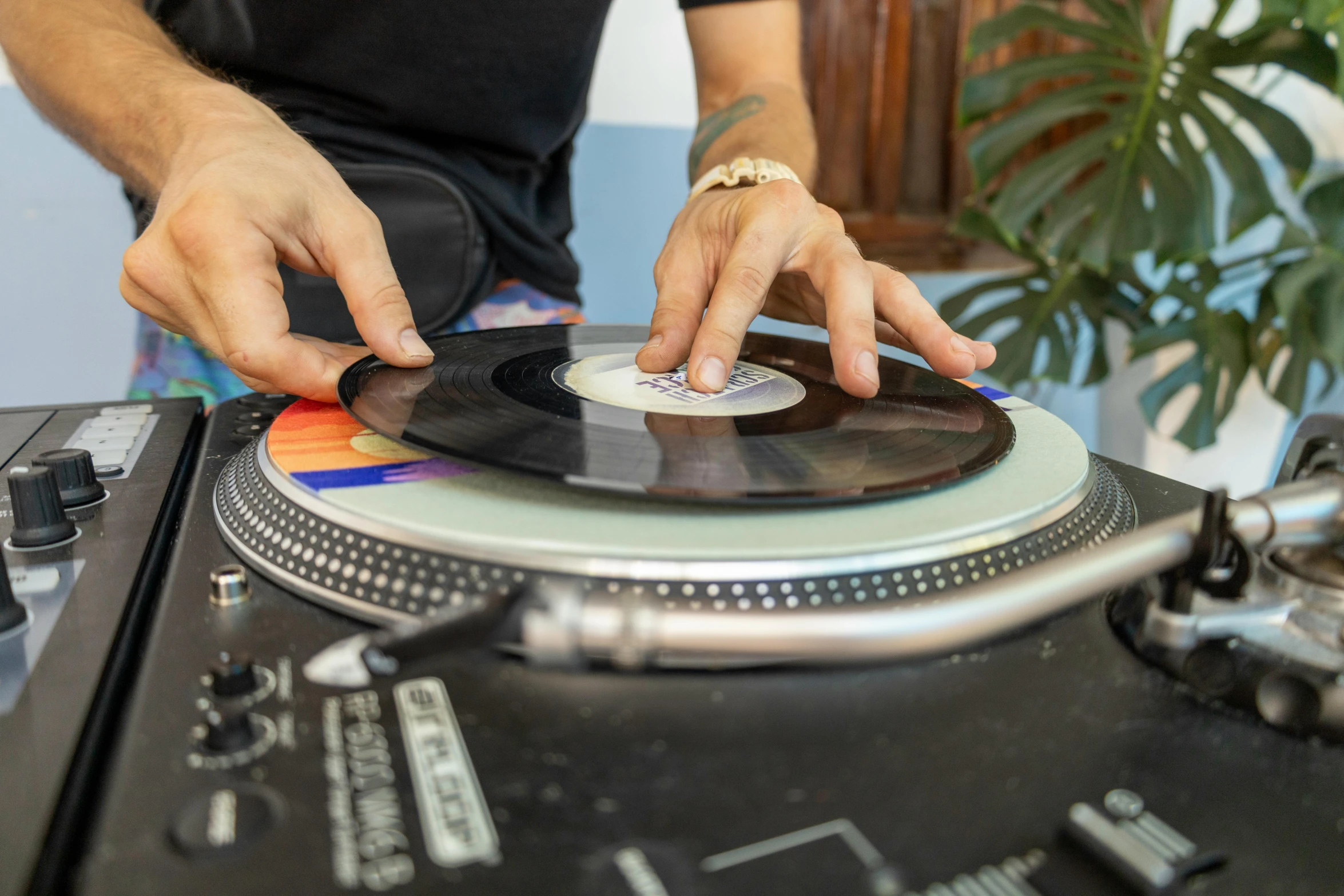 a person playing with an open turntable