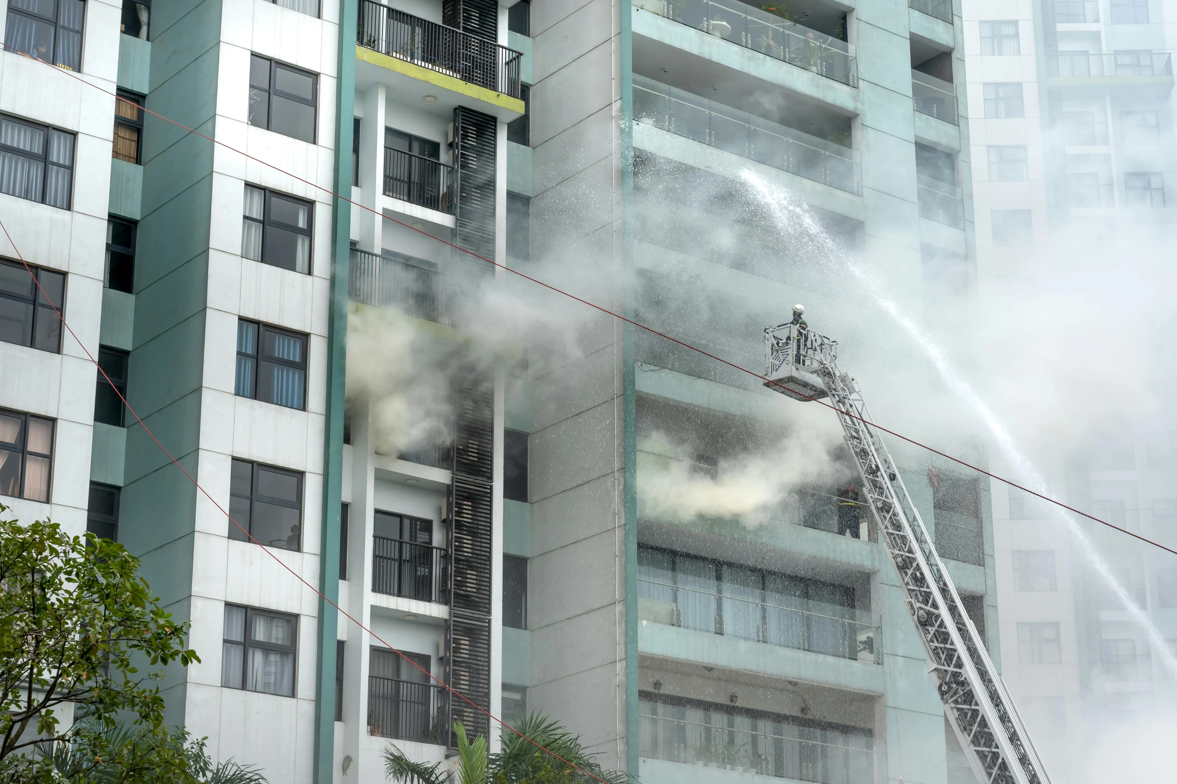 firefighters are doing their best to put out a fire