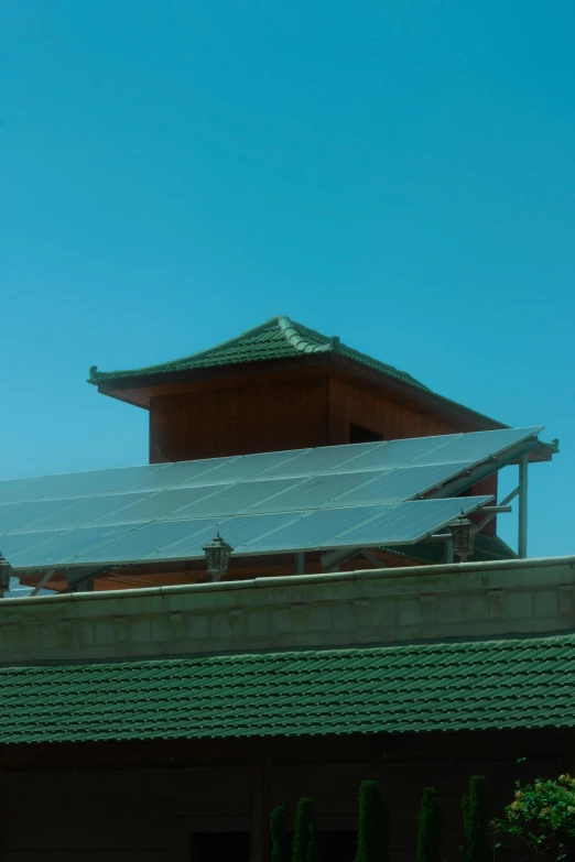 a red building with roof is shown in the air