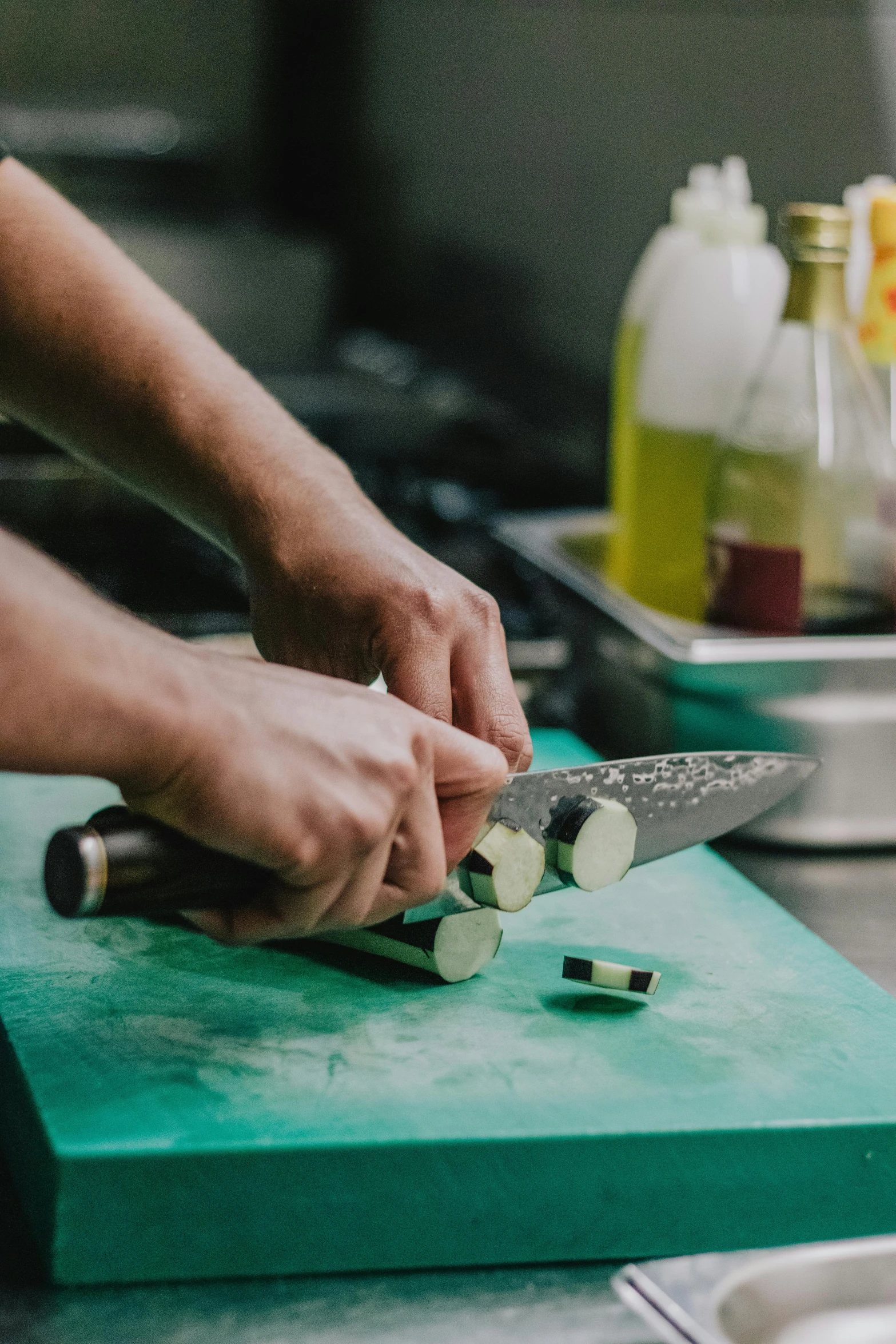 a person with chopping utensils on a  board