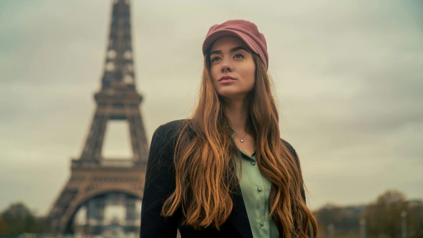 the woman is in front of the eiffel tower