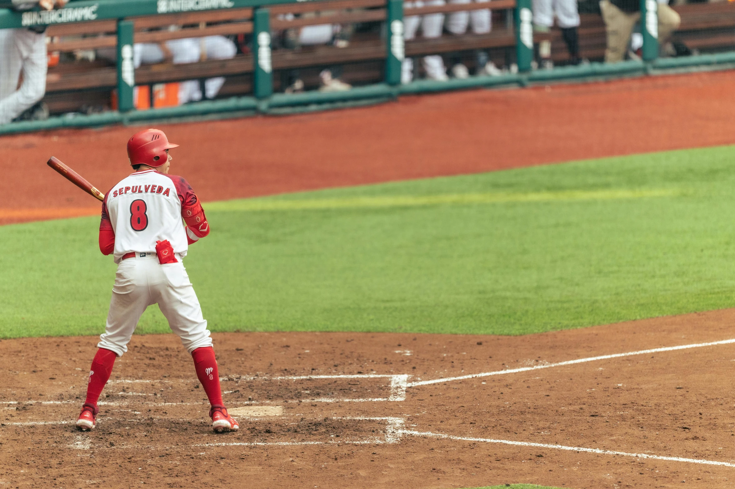 there is a baseball player that has just swung at the ball