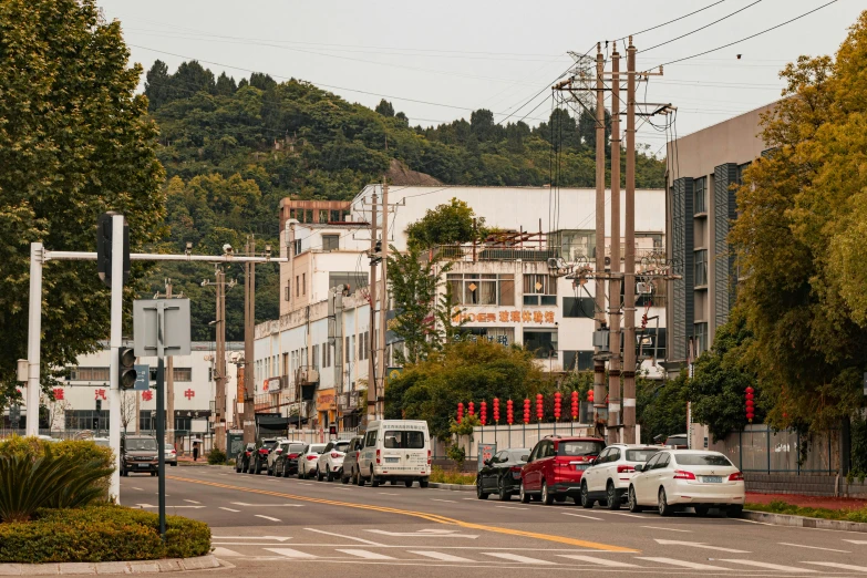 a busy city street that is lined with cars