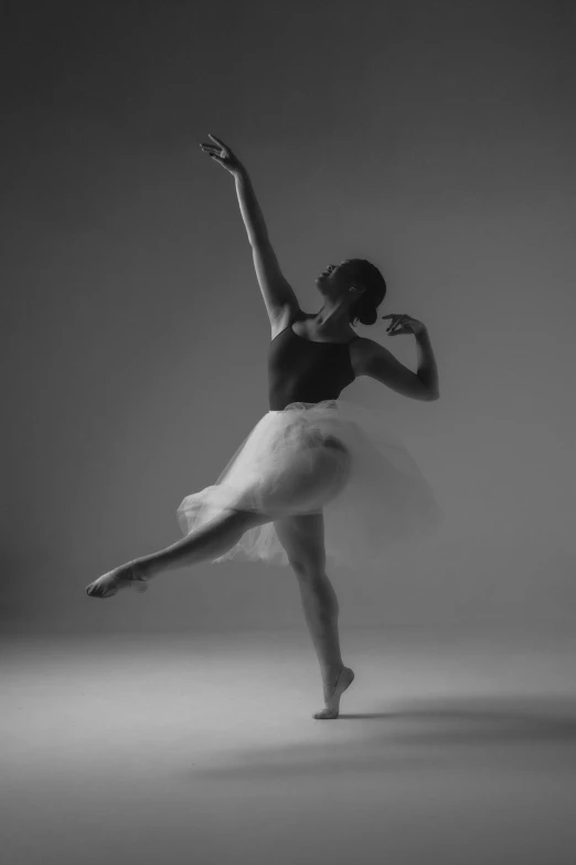 a dancer is performing in the air with her arms extended