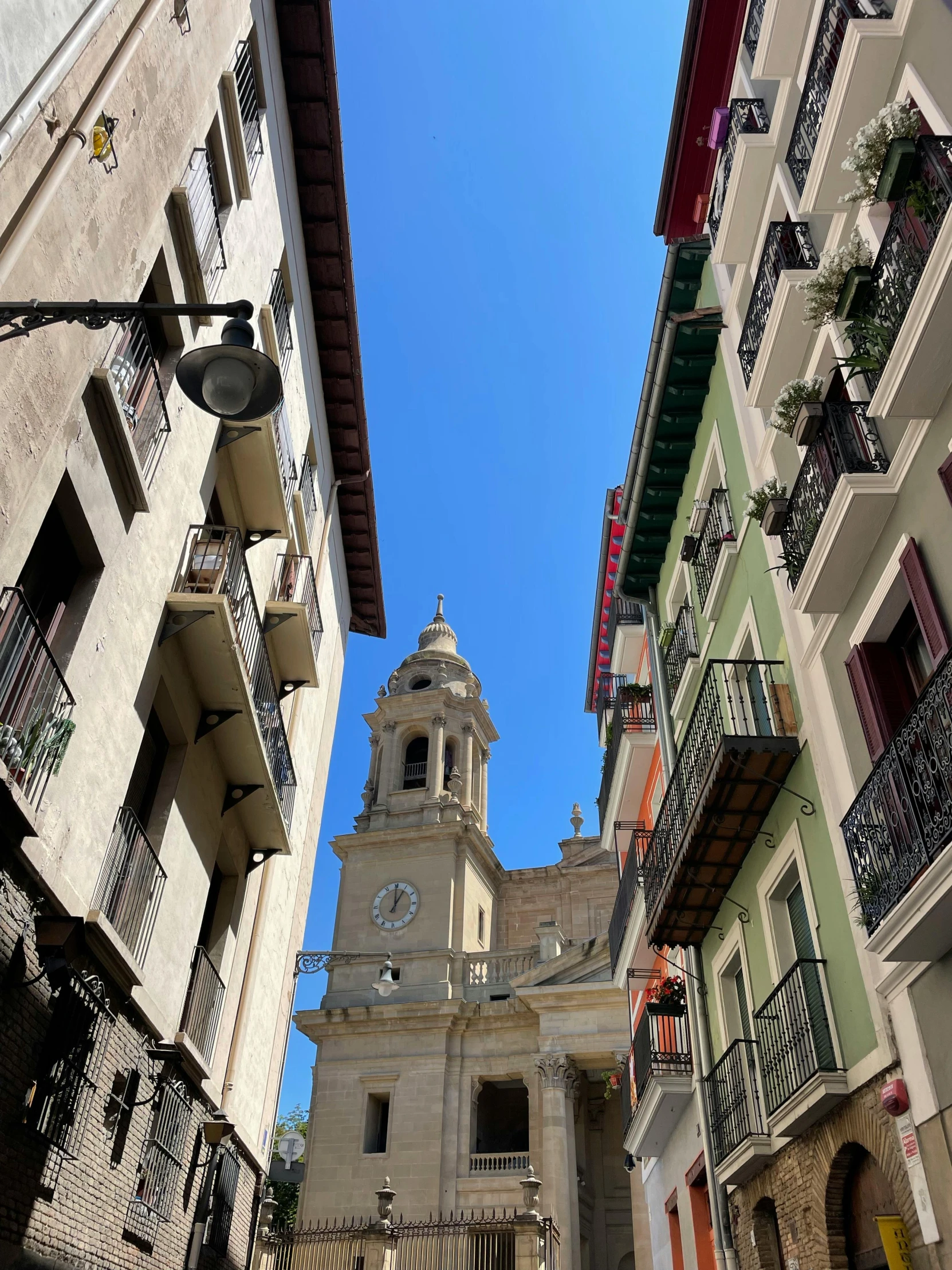 a tall church towering over a city filled with buildings