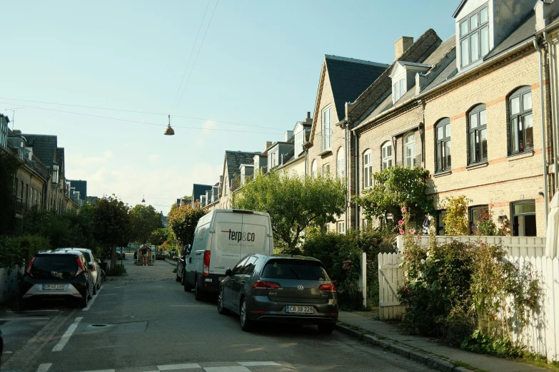 several vehicles are stopped on the side of the street