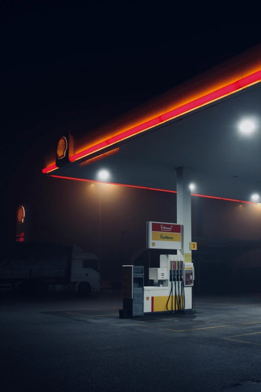 an oil station has a gas pump with four lights on
