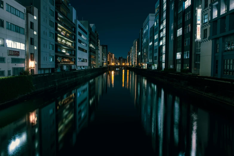 there is a river running next to several building