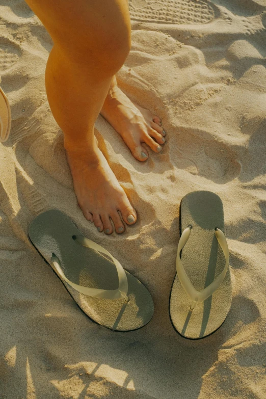 someone has just finished laying on the sand of their feet