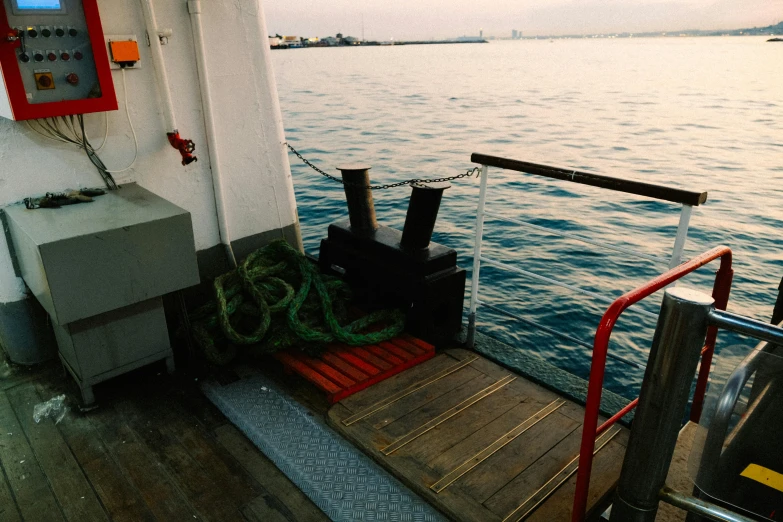 the back of a ferry boat moving along a body of water