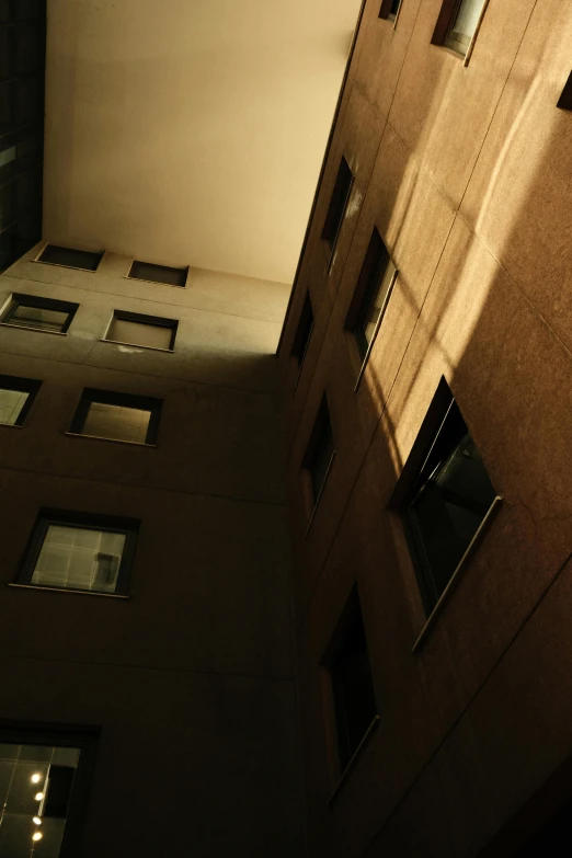 a dark picture of a building and the reflection of it in a window