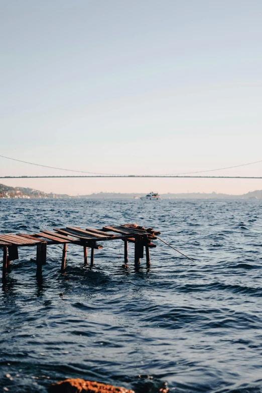 a wooden pier sits in the middle of a lake