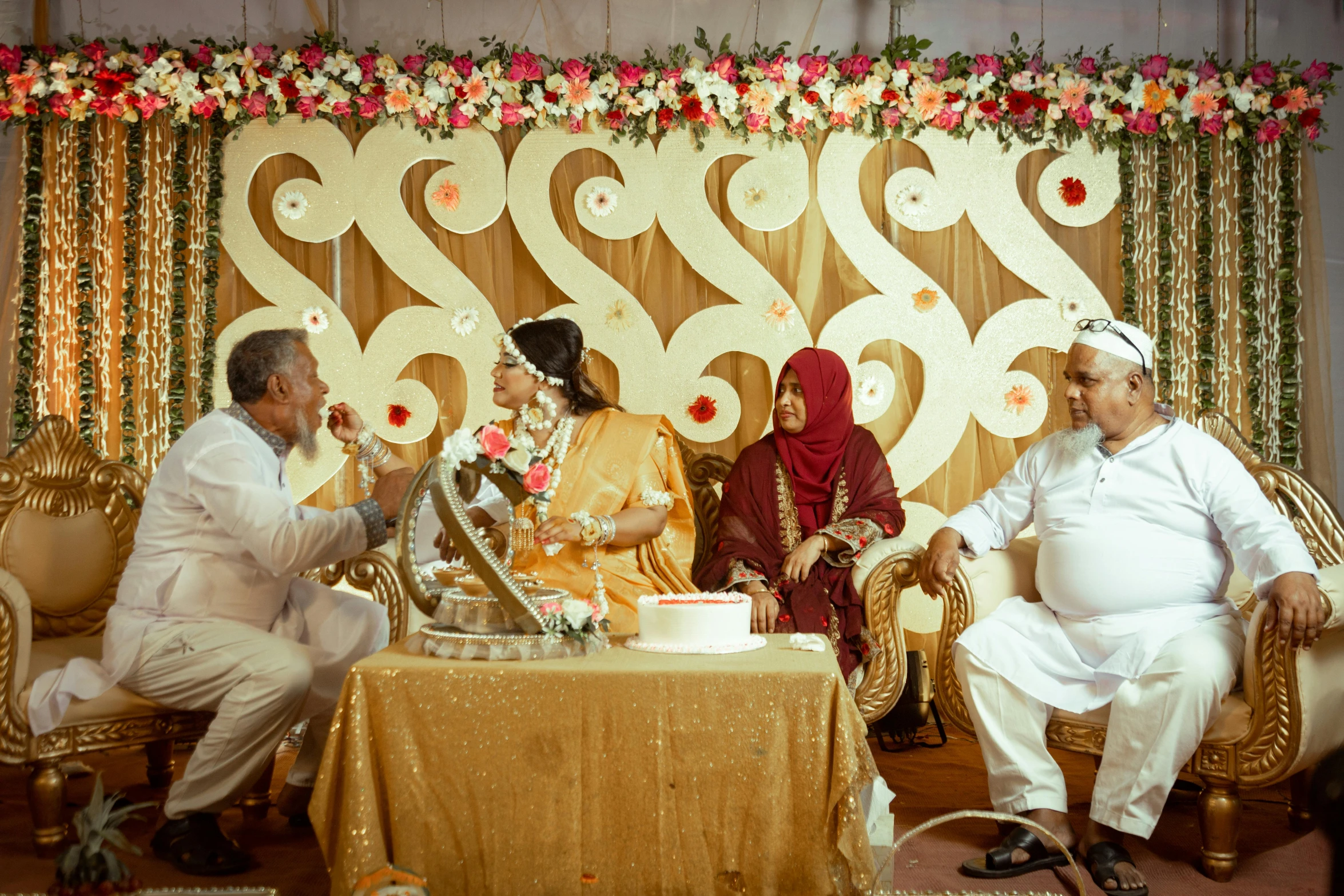 the man and woman are talking about their wedding cake