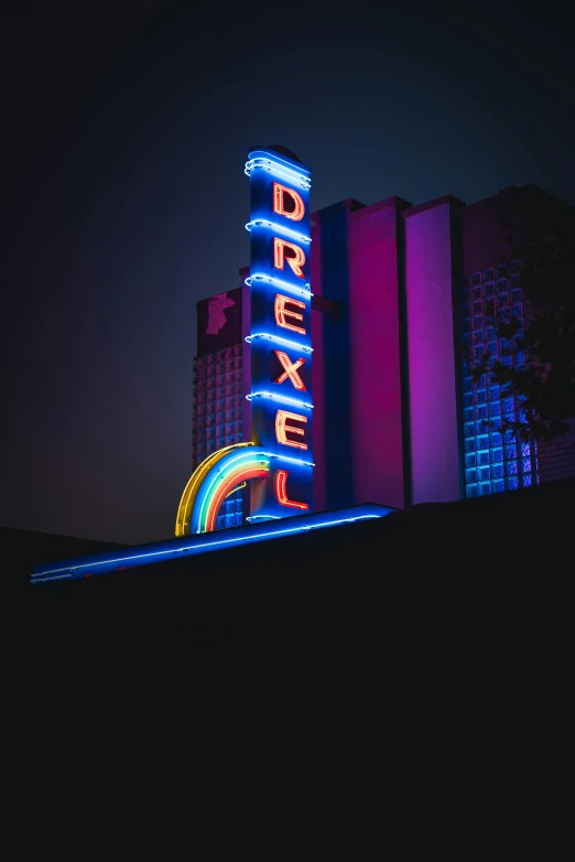 the neon sign is advertising neon in the dark