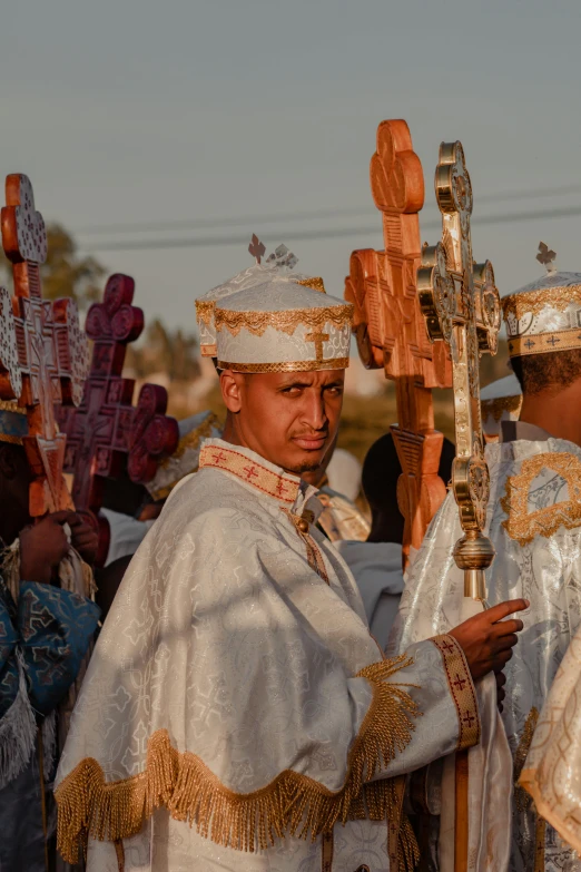 a group of men dressed in costume for a religious event