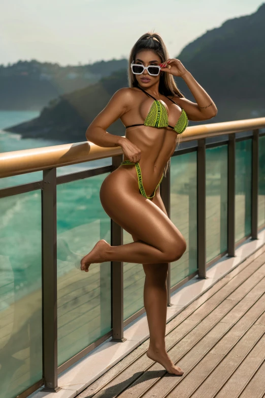 this beautiful woman is posing  while wearing sunglasses