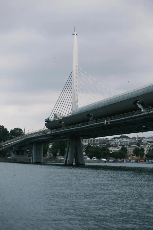 a train bridge on the side of a river