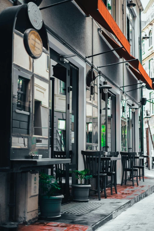 an empty restaurant sitting next to some buildings