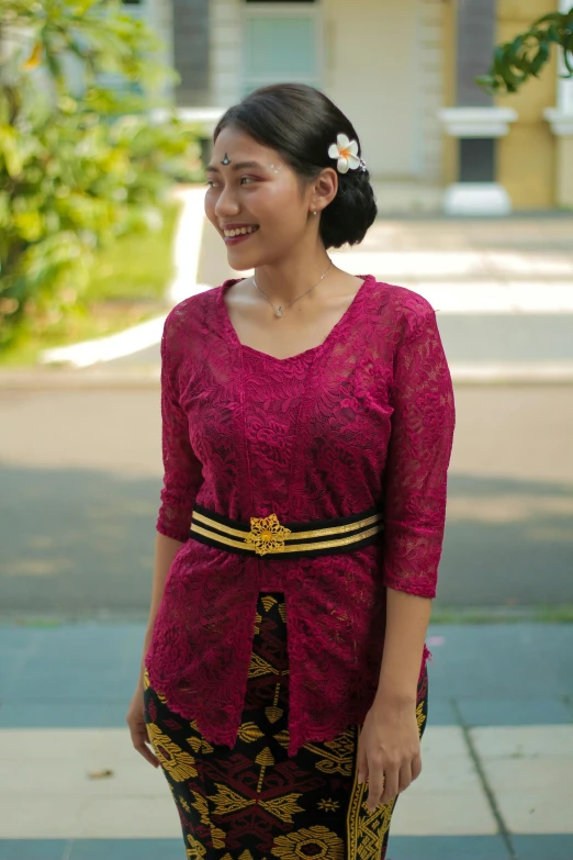 an asian woman wearing a red dress, and holding a white umbrella