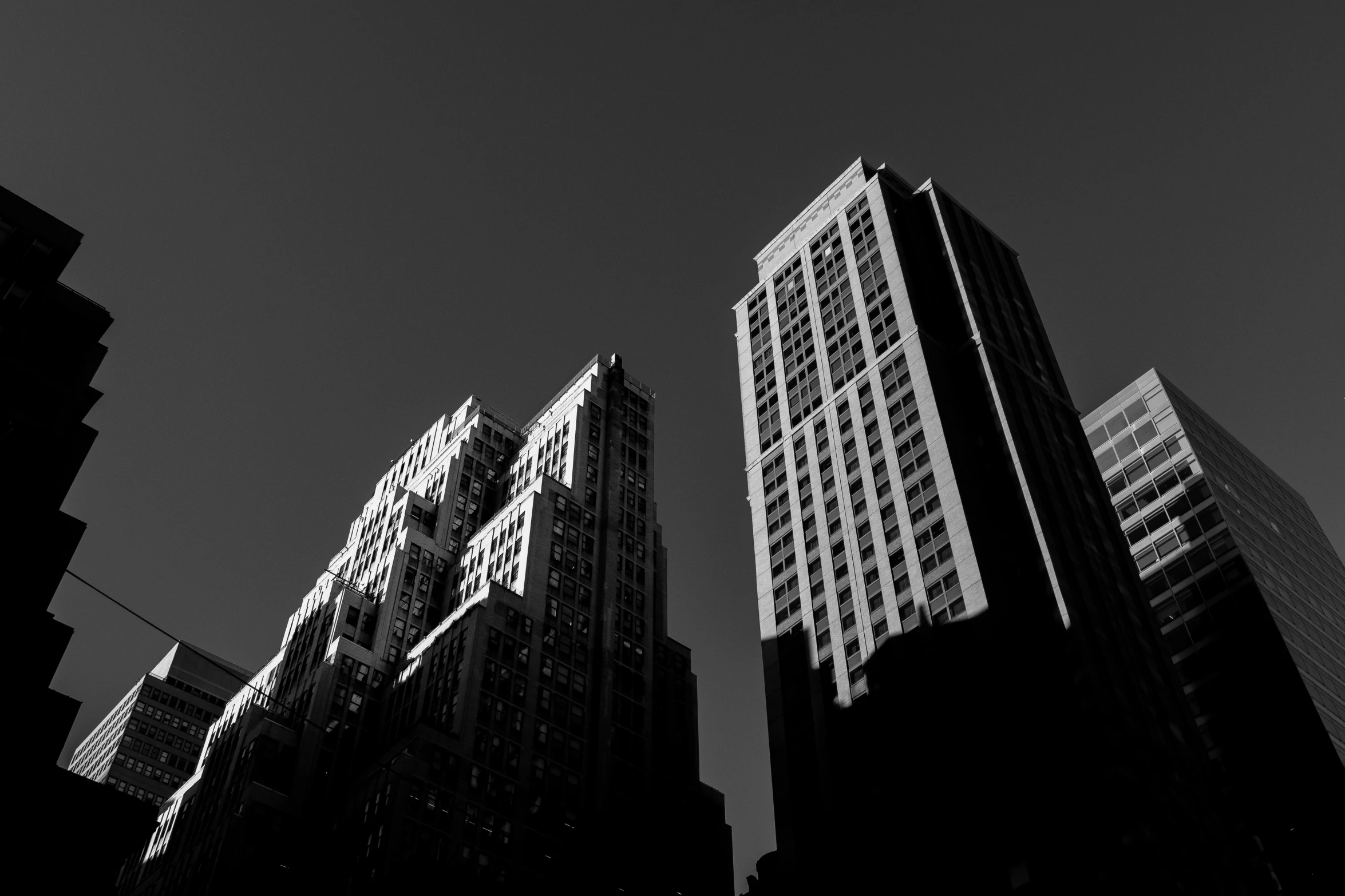 a line of tall buildings against a dark sky
