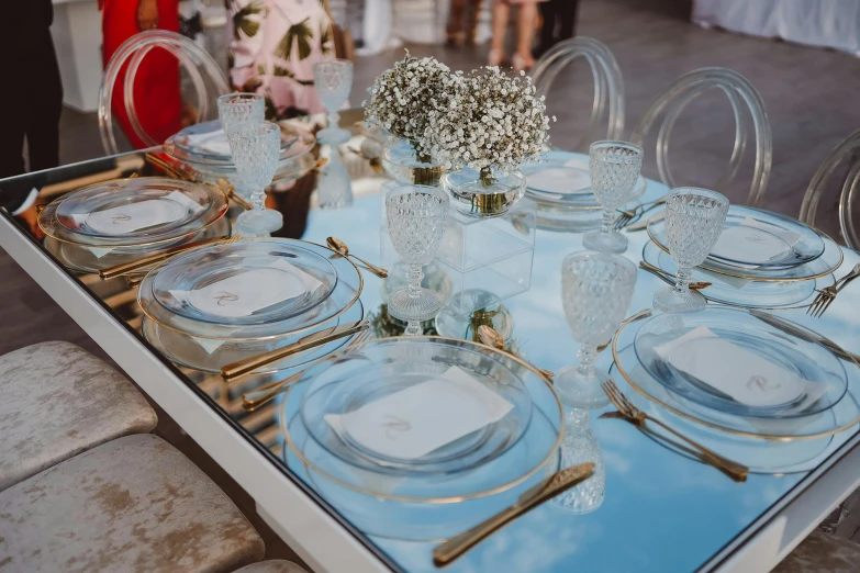 a table set with clear place setting for an event