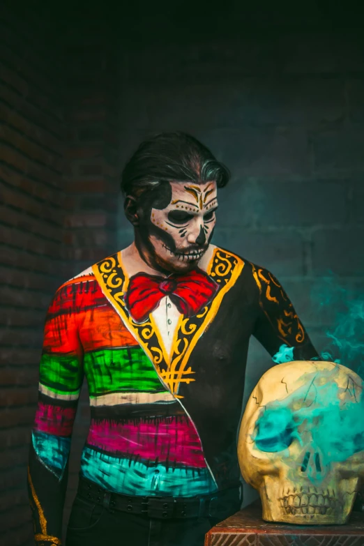 a person with makeup and skull painted on their face