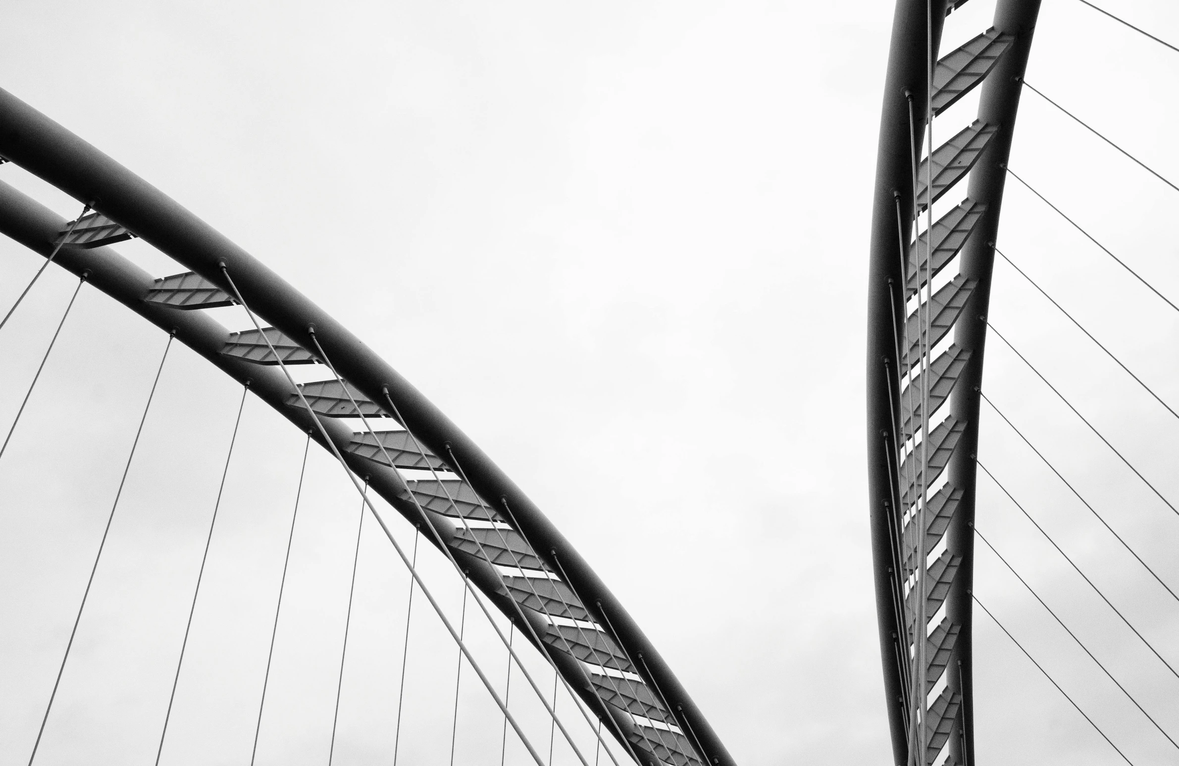 a large long suspension bridge spanning over a river