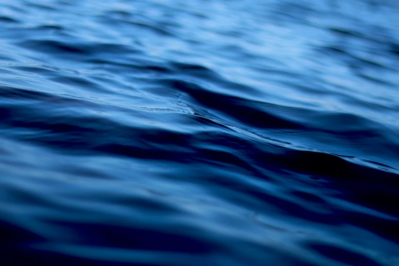 the water is dark blue as well as some ripples