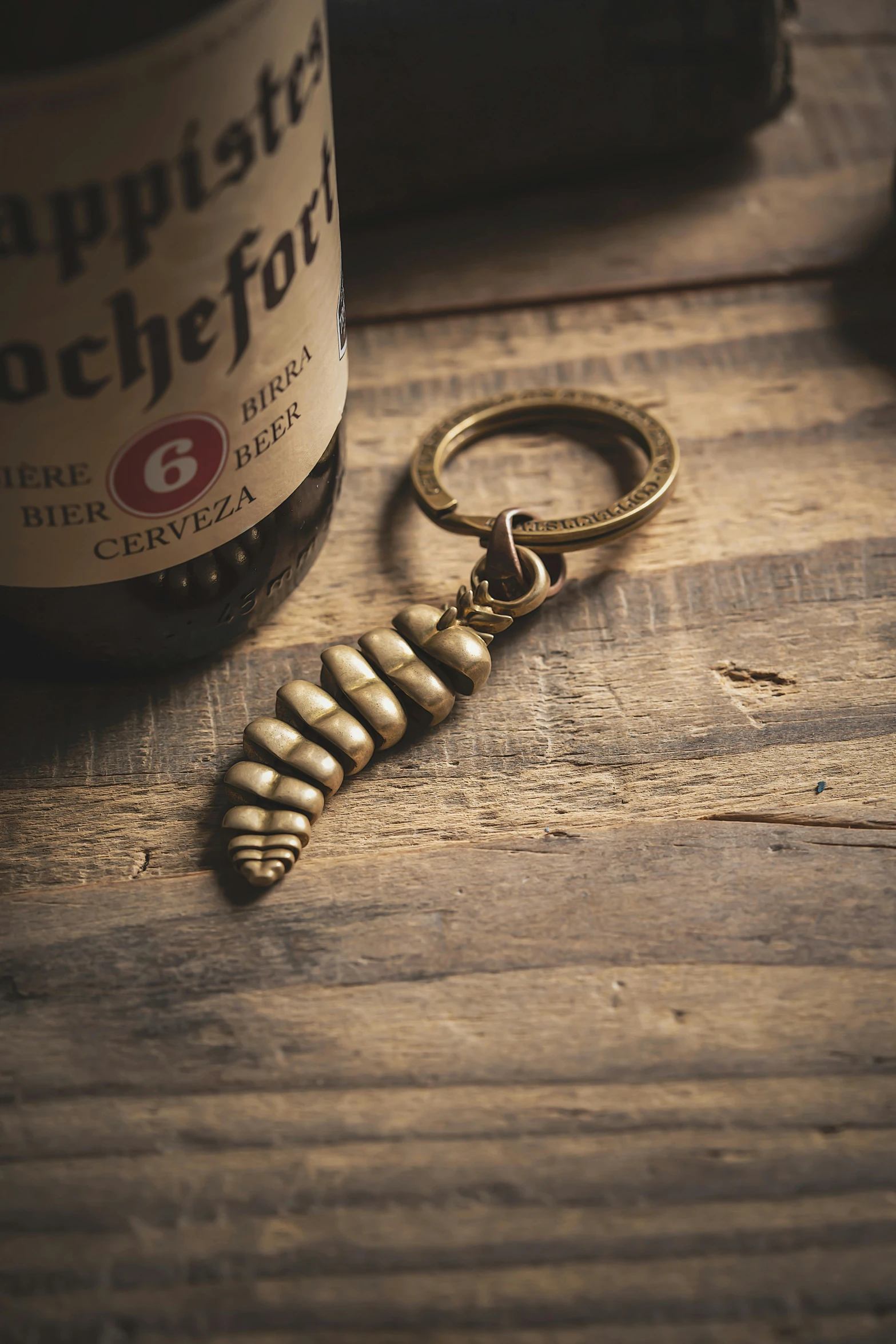 there is an antique wine bottle keychain and the key chain