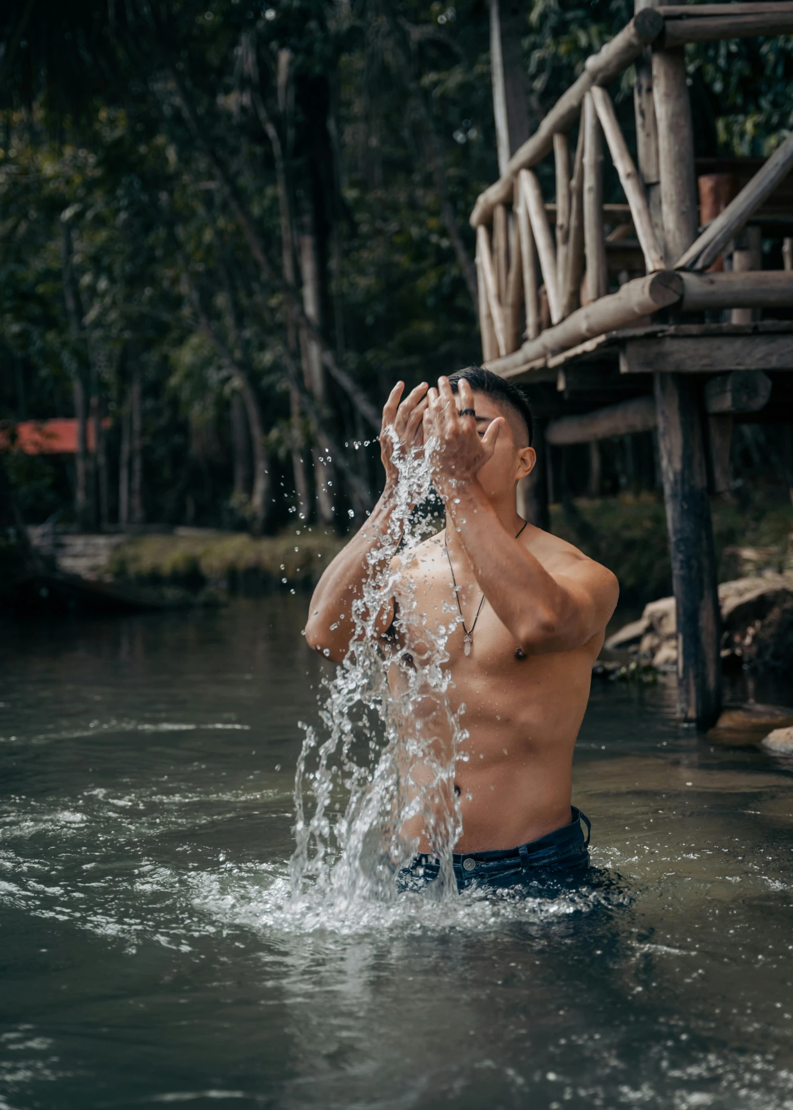 the young man is playing in the water outside