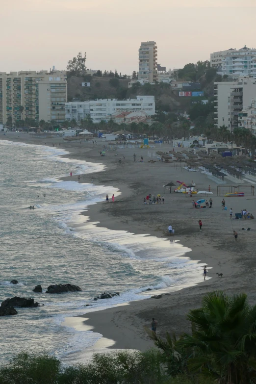 view of people relaxing at the beach and the ocean