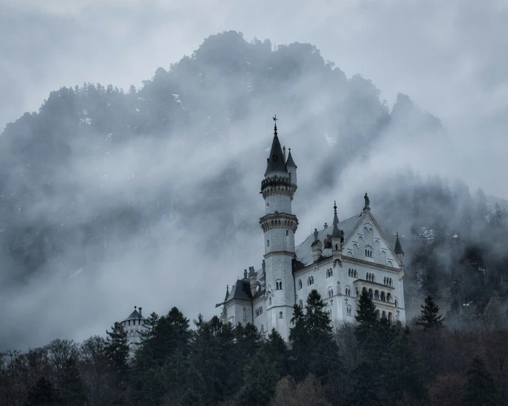 an image of the castle on a hill in front of a cloudy sky