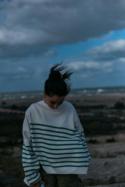 young woman with black hair walking alone