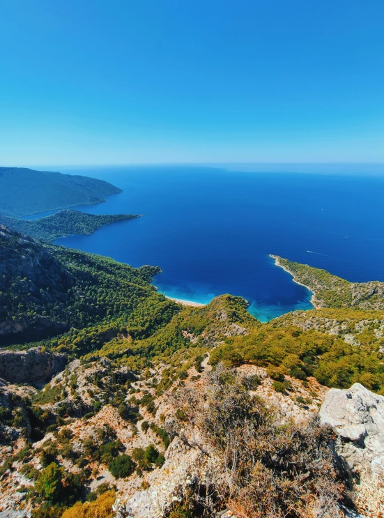 a lake and some land by itself by the sea