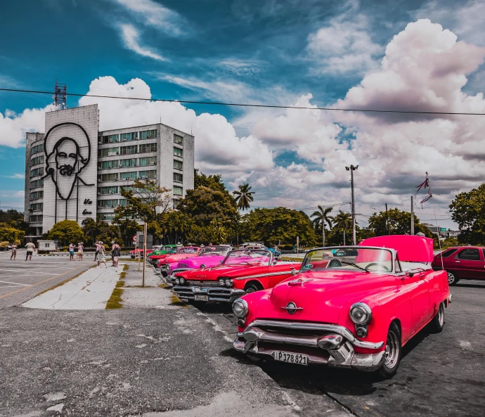 the classic cars are all lined up in rows