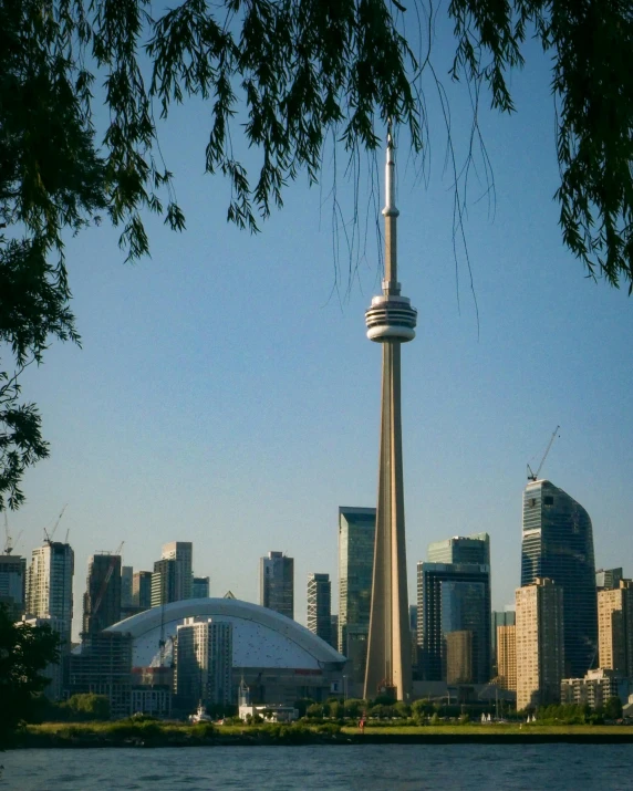 a picture of a very tall building by the river