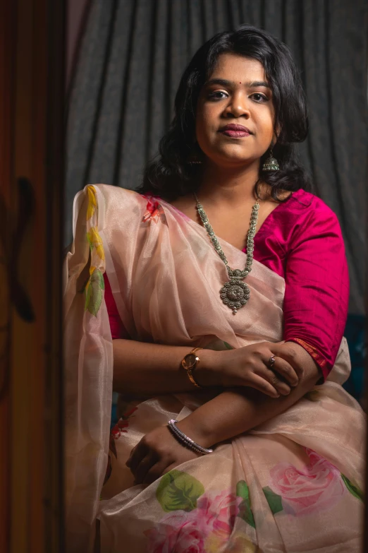 a woman in a sari posing for a po