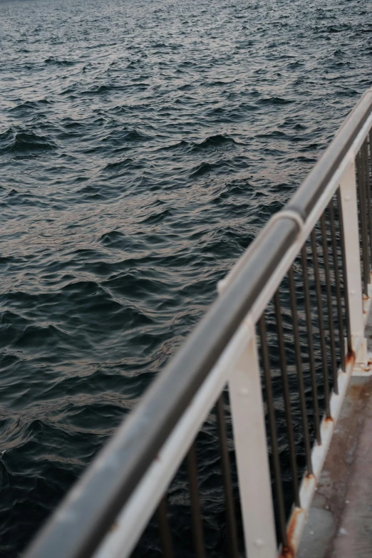 view over the ocean from deck of a ferry boat