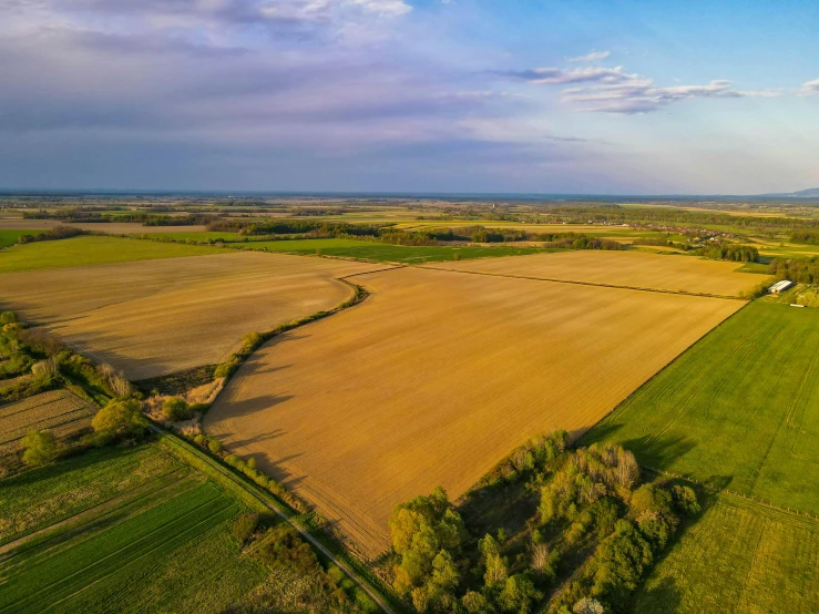 an aerial view of farmland land in the countryside