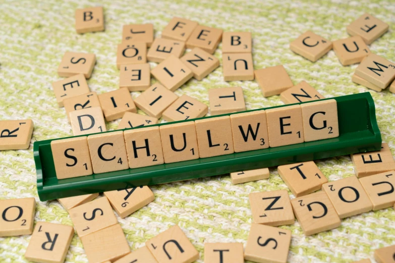 scul weg words sitting on a table surrounded by scrabble