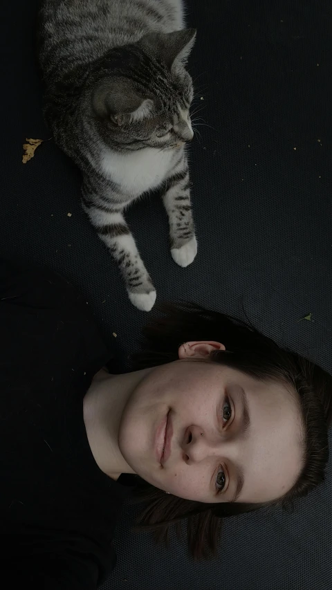 a  is laying next to a cat