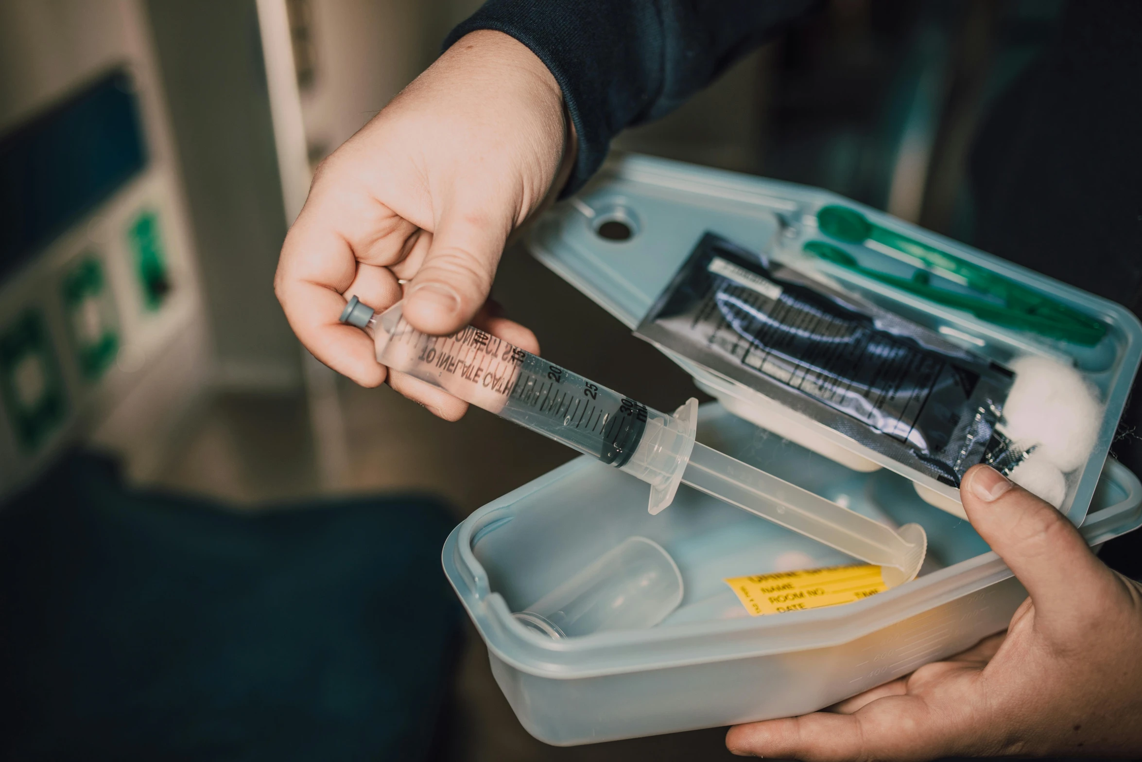 two people in an emergency room hold a knife and scissors