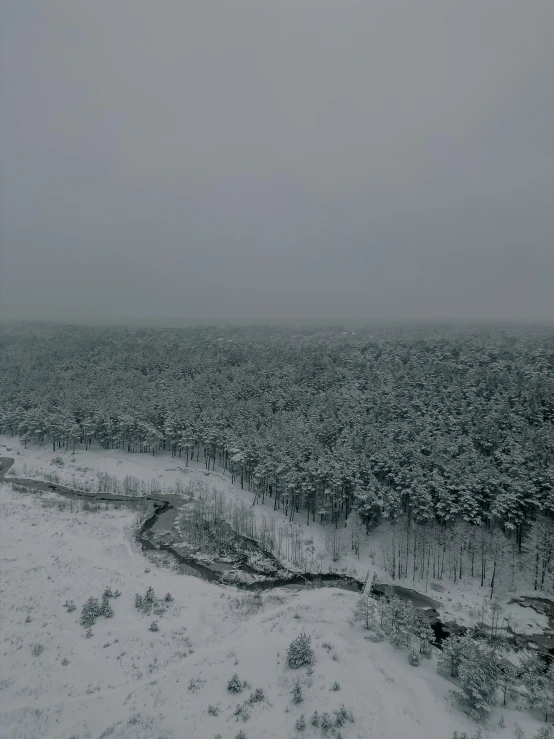 the sky has a thick layer of snow covering a snowy landscape